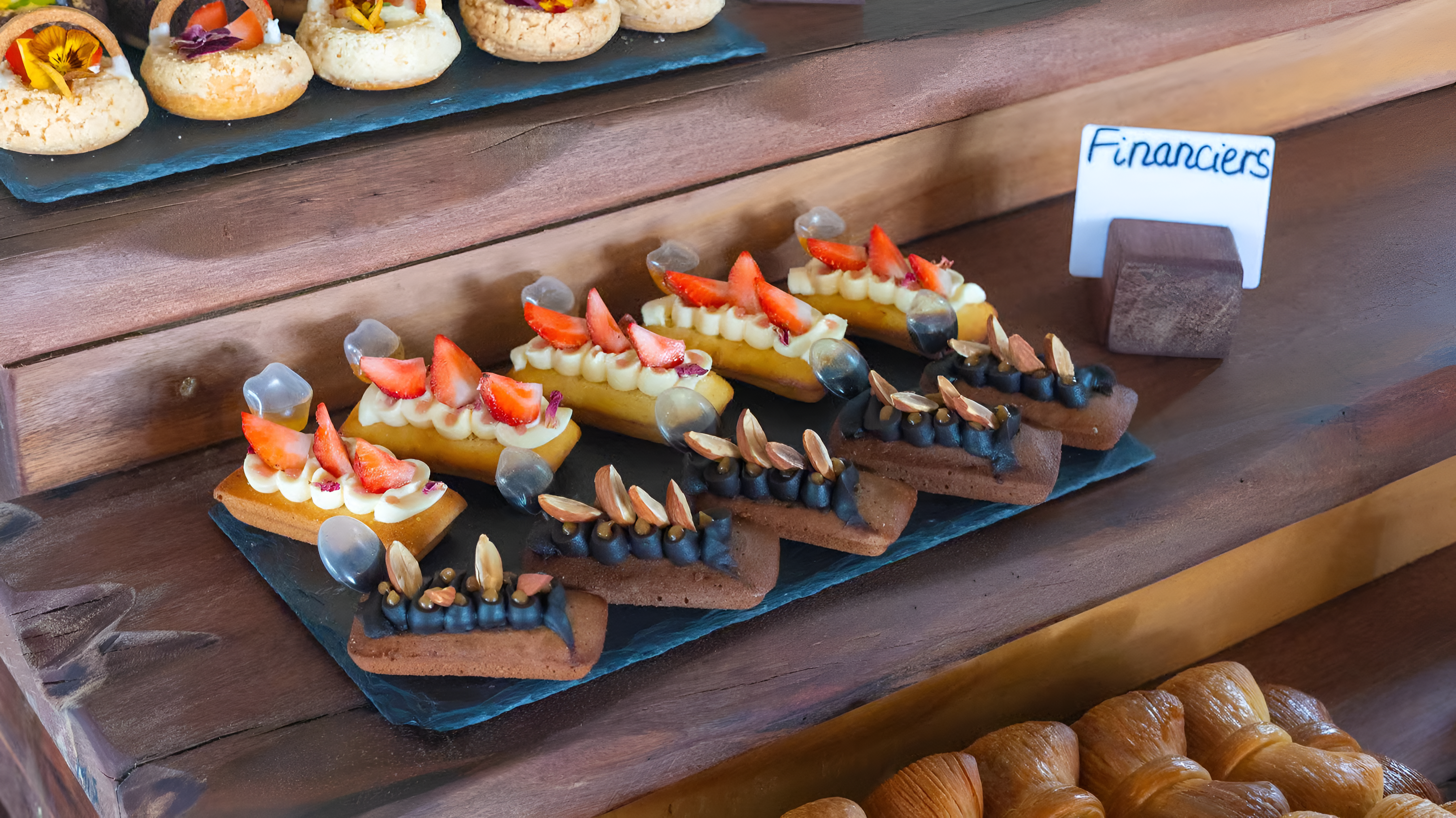 Pastry display with financiers and croissants