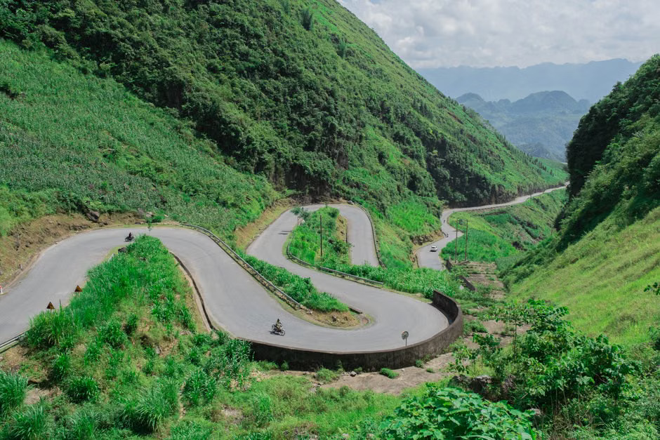 Motorbike on a winding mountain road of the Ha Giang Loop